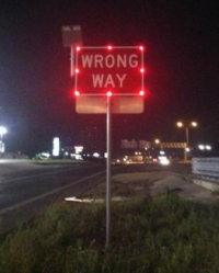 Flashing wrong-way sign